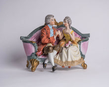 BISQUE COLONIAL COUPLE ON COUCH